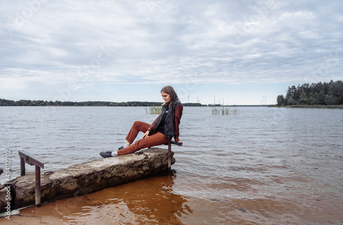 young woman near the water river horizon autumn water body of water leather j