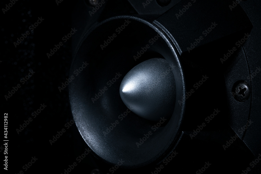 Side view, High-pitched speaker in the dark, close up Side view, High-pitched speaker in the dark, close up
