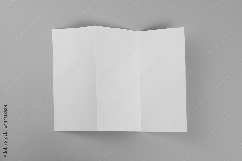 Blank paper brochure on light grey background, top view. Mockup for design Blank paper brochure on light grey background, top view. Mockup for design