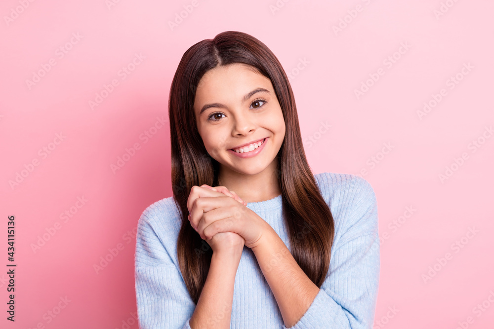 Portrait of attractive pleased cheerful girl enjoying pleasant news isolated over pink pastel color background