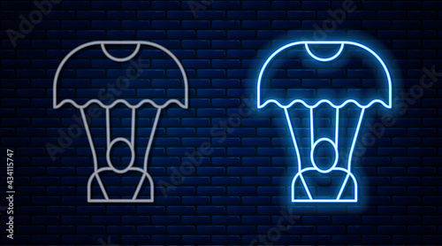 Glowing neon line Parachute icon isolated on brick wall background. Vector