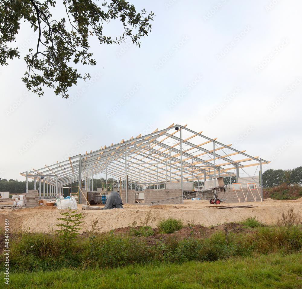 Building a new cattle stable. Construction site. Framework. Farming. Netherlands. Building a new cattle stable. Construction site. Framework. Farming. Netherlands.
