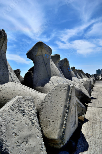 stone cross on the beach - breakwater pier in the sea - Olimp, Mangalia, Constanta county, Dobrudja, Romania