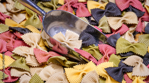 Colored Farfalle Pasta bow tie pasta background.