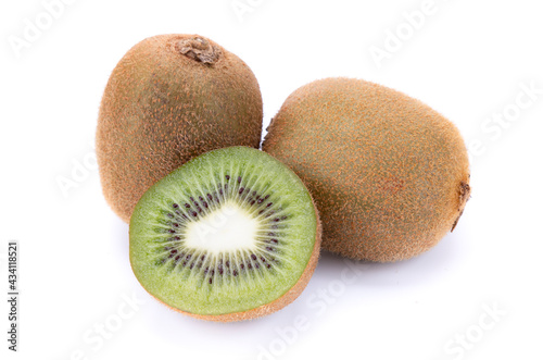 Two whole kiwi and half cut on a white background, isolated