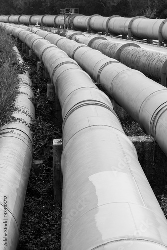 steel long pipe in crude oil factory. Industrial background