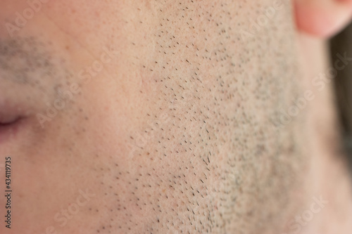 Caucasian male short unshaven facial hair stubble macro close up shot unrecognizable face
