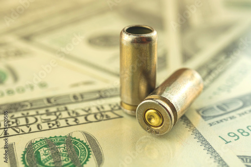 Bullet and dollars on the background, crime and mafia, bloody money concept, corruption