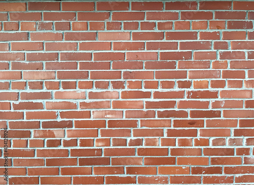 the wall of the building is made of red brick