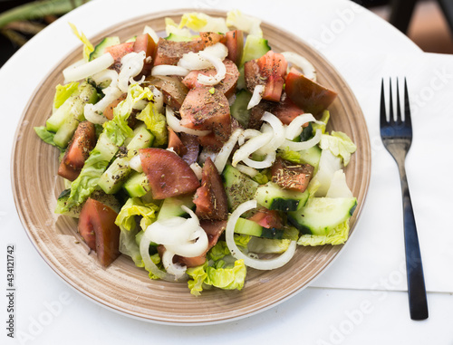 vegetarian healthy vegetable salad on brown plate
