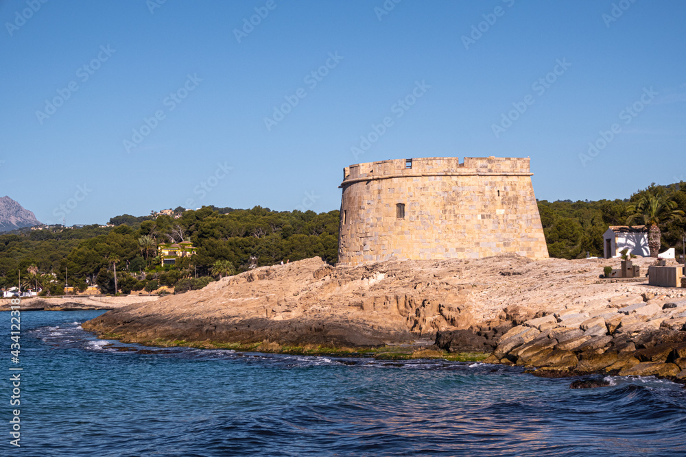 Moraira Castle, on a morning with a clear blue sky.