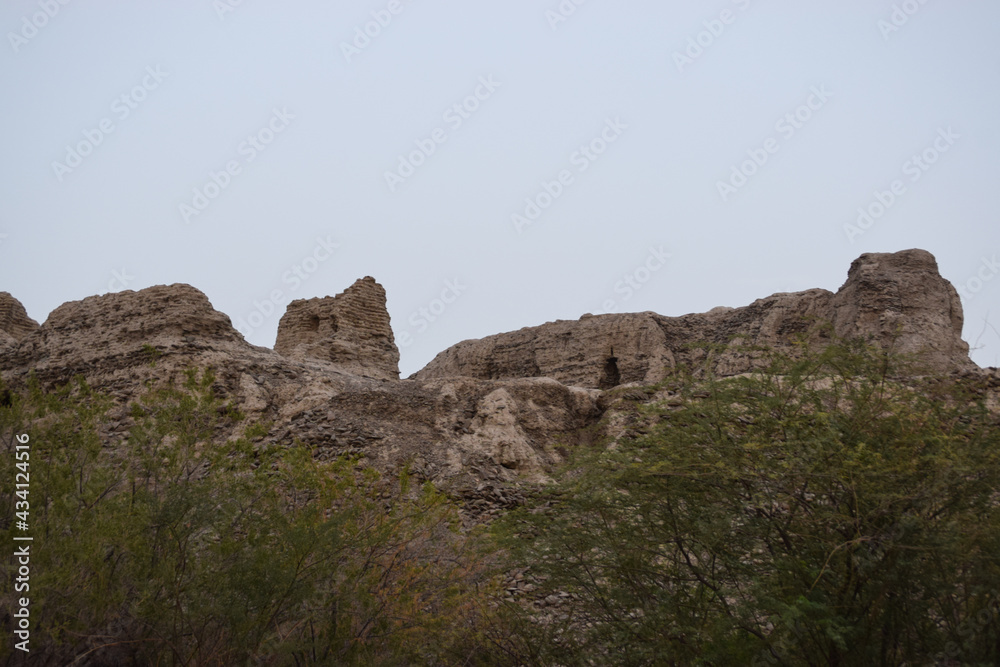 A historical place in Mir e Kalat near Turbat Kech with view of beautiful mountain, dates tree summer season Balochistan Pakistan photo