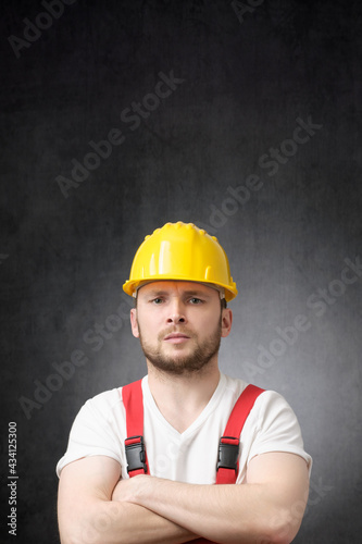 Annoyed construction worker with his arms crossed