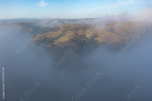 The marine layer sweeps over the serene hills of the East Bay, just east of San Francisco Bay, California. This area has a number of parks and open spaces available to explore by hiking and biking.