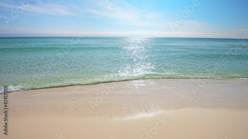 Shiny glitter shimmer wave sun reflections on sea ocean water with small ripples on sunny day on beach at Miramar or Destin city town, Florida panhandle of Gulf of Mexico