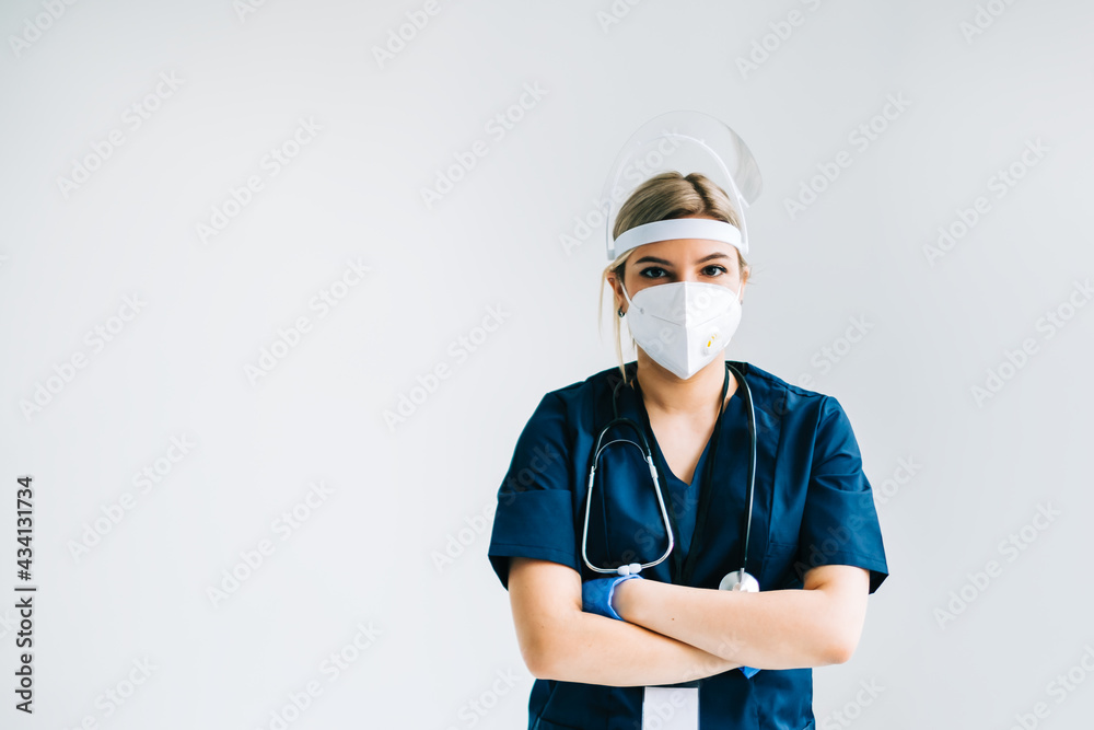 Portrait of young confident woman nurse hospital worker in medical protective mask isolated on white background. Portrait of young confident woman nurse hospital worker in medical protective mask isolated on white background.