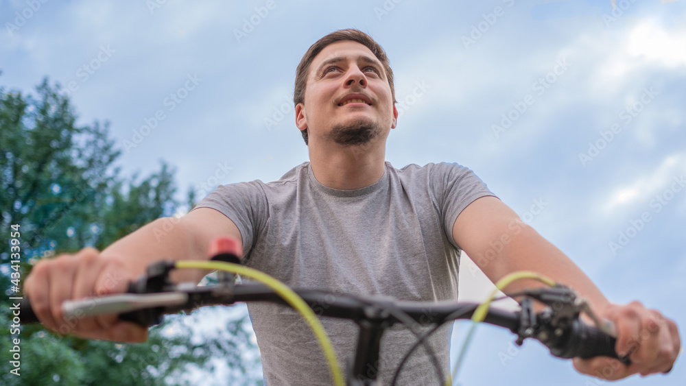 young man driving a bicycle