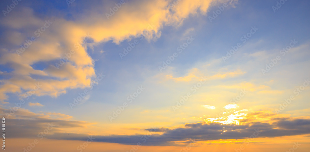 Sunlight sunrays or sunbeams over clouds and blue sky like heaven for background.