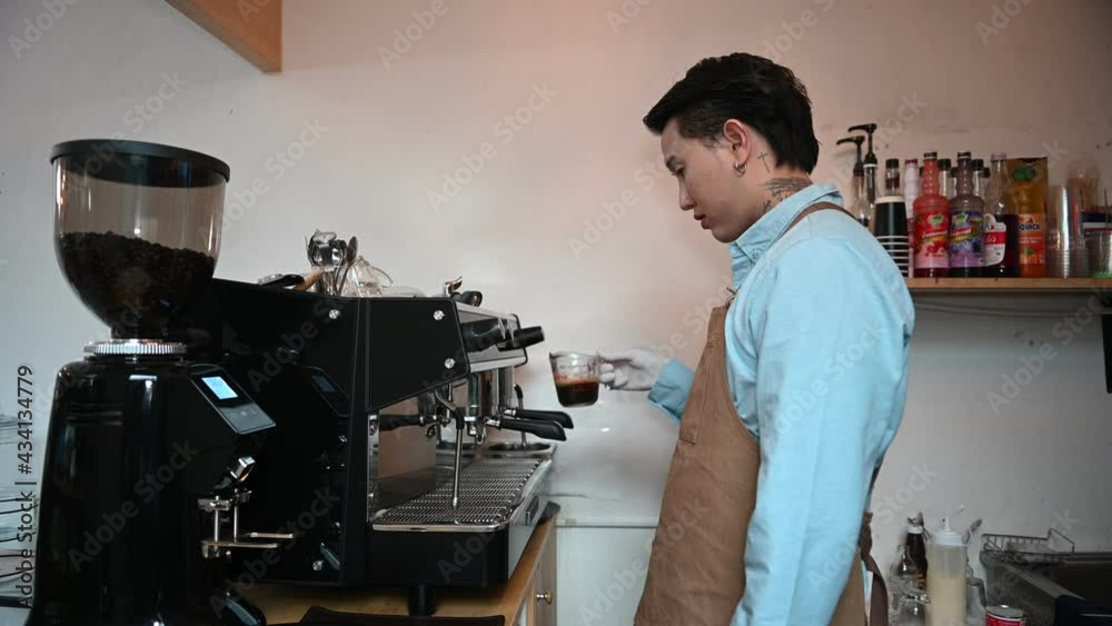 Handsome asian barista in the coffee shop,Small and Medium Enterprises concept Handsome asian barista in the coffee shop,Small and Medium Enterprises concept