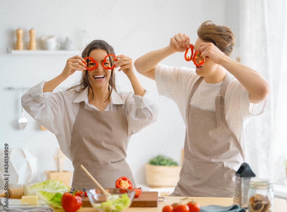 loving couple is preparing the proper meal loving couple is preparing the proper meal