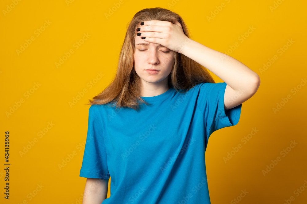 Exhausted woman makes face palm, looks bothered and unitnerested, feels unhappy and tired, dressed casually, isolated on green background, fed up of working late hours and deadline. Exhausted woman makes face palm, looks bothered and unitnerested, feels unhappy and tired, dressed casually, isolated on green background, fed up of working late hours and deadline.