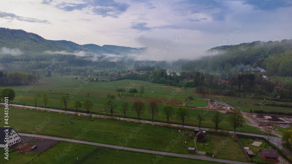 View of the Table Mountains in misty weather. Spring, Radków, Poland. View of the Table Mountains in misty weather. Spring, Radków, Poland.