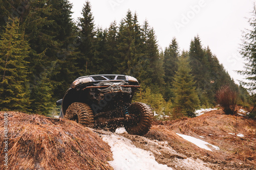 Offroad car jump in the mountains. Pollen, swamp and snow. Affortation, suspension, tires