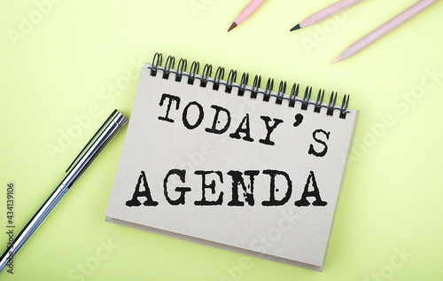 Wallpaper Mural TODAY'S AGENDA text on the notebook with pen on yellow background Torontodigital.ca