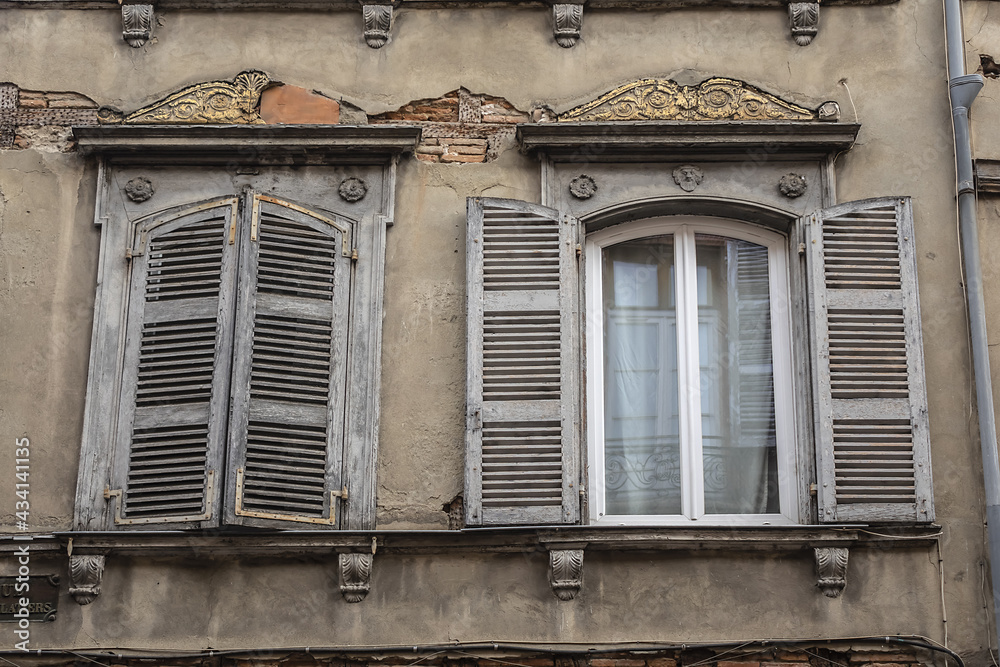 Architectural fragments of the design of an old French house in Toulouse Old town. Toulouse, Haute-Garonne, France.