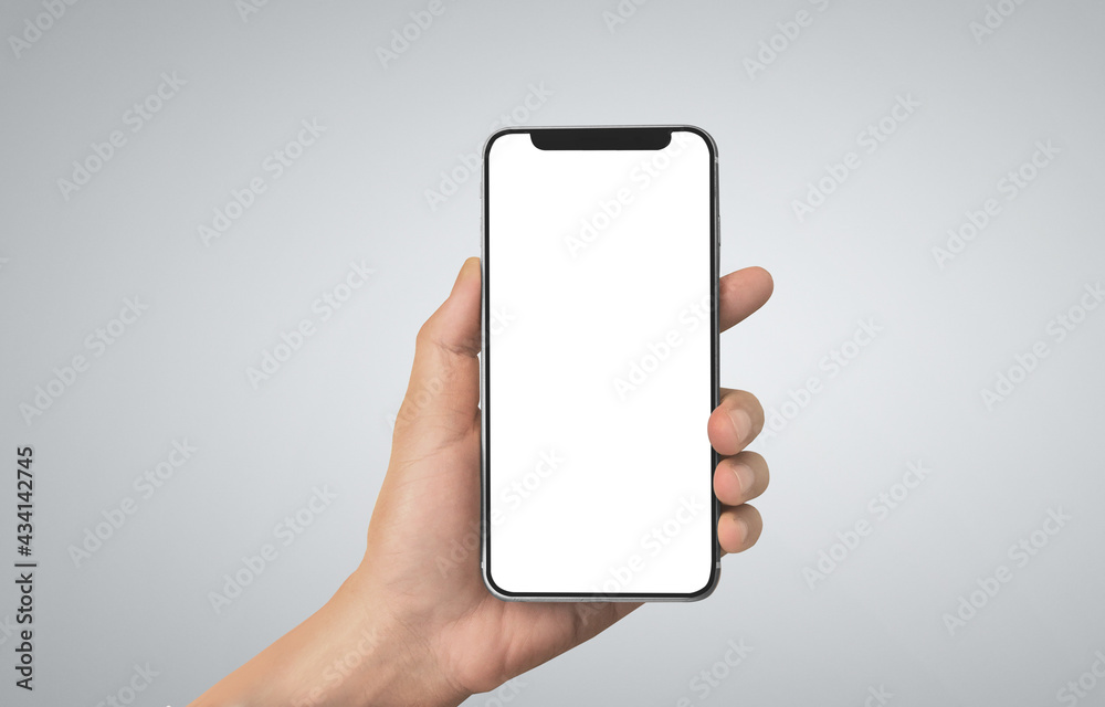 Hand holding smartphone device touching screen Hand holding smartphone device touching screen