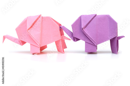two follow origami elephants on white