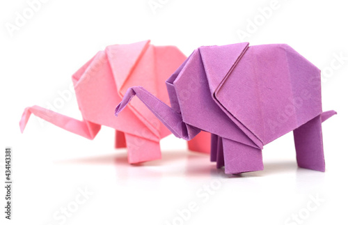 Photography two standing origami elephants