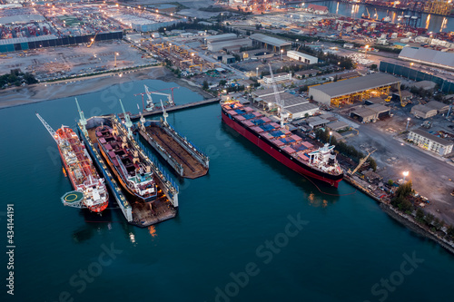 Aerial view Container ship repair in shipyard at twilight over lighting © SHUTTER DIN