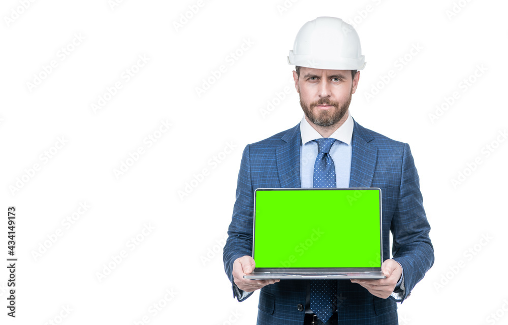 businessman man in suit and safety helmet showing green screen of laptop copy space, presentation. businessman man in suit and safety helmet showing green screen of laptop copy space, presentation.