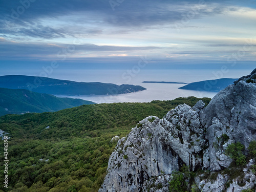 Panoramic view of the entrance to the Bay of Kotor, Herceg Novi, Montenegro, with the mountains at sunset.