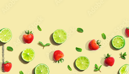 Fresh limes and strawberries with mints