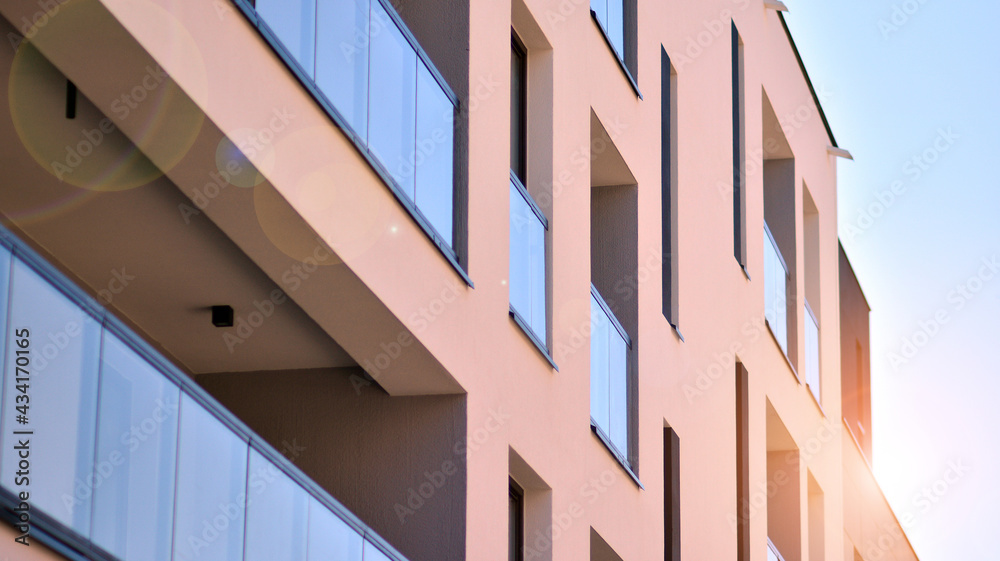 Apartment residential house and home facade architecture and outdoor facilities. Blue sky on the background. Sunlight in sunrise. Apartment residential house and home facade architecture and outdoor facilities. Blue sky on the background. Sunlight in sunrise.
