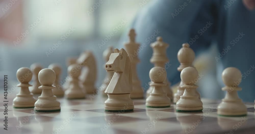 Senior man playing chess at home Senior man playing chess at home