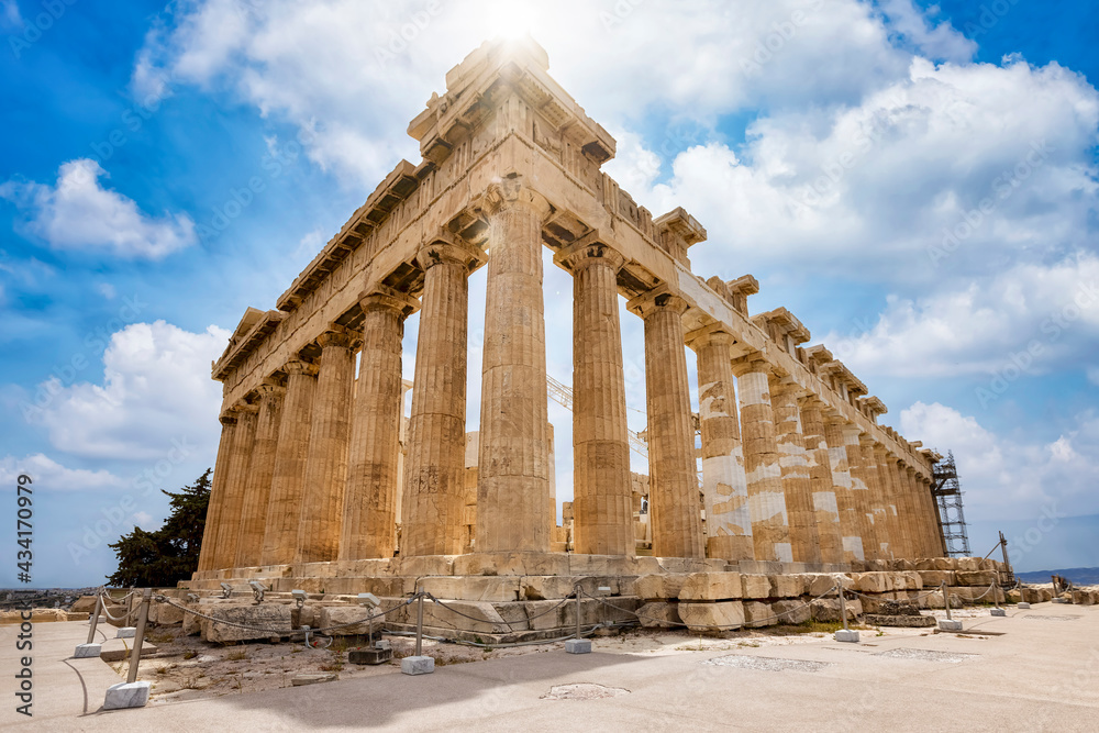 Low angle view of the marble columns of the Parthenon Temple at the Acropolis of Athens, Greece, during a sunny day without people