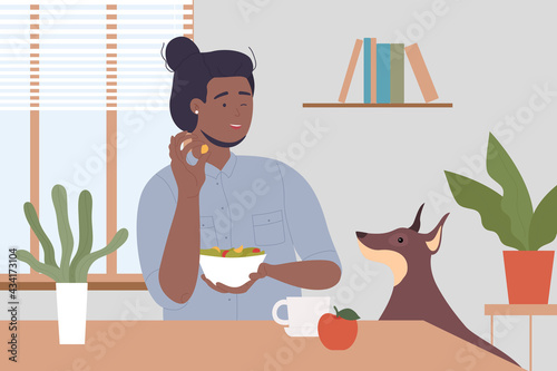 Cooking man in kitchen with dog pet vector illustration. Cartoon happy young pet owner male character sitting at table in interior of room with kitchenware tools, holding doggy food background