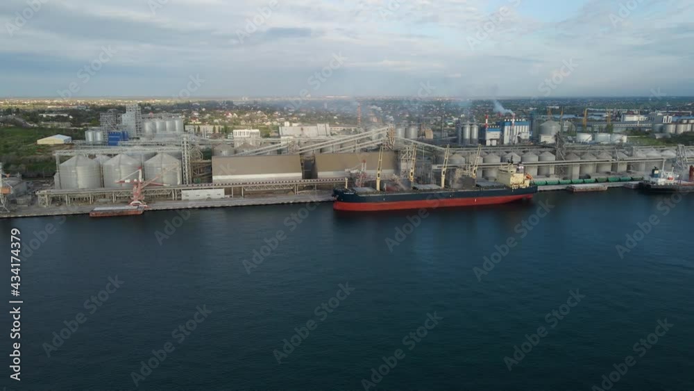 4K modern industrial port with containers from top or bird's eye view. It is a port for import and export cargo and is part of the shipping dock. Europe 4K modern industrial port with containers from top or bird's eye view. It is a port for import and export cargo and is part of the shipping dock. Europe