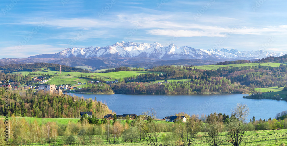 Landscape with Czorsztyn Lake and snowy Tatra mountains on background, Poland