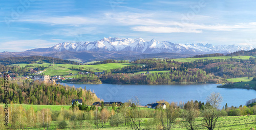 Landscape with Czorsztyn Lake and snowy Tatra mountains on background, Poland photo