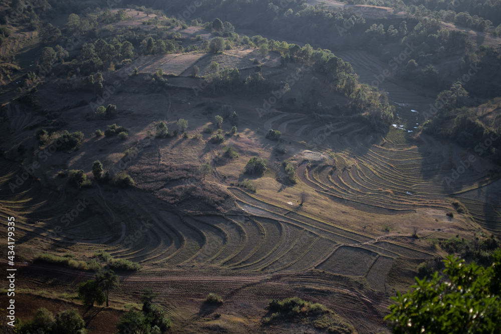 Viewpoint looking over terraced rice fields during sunset, Myanmar