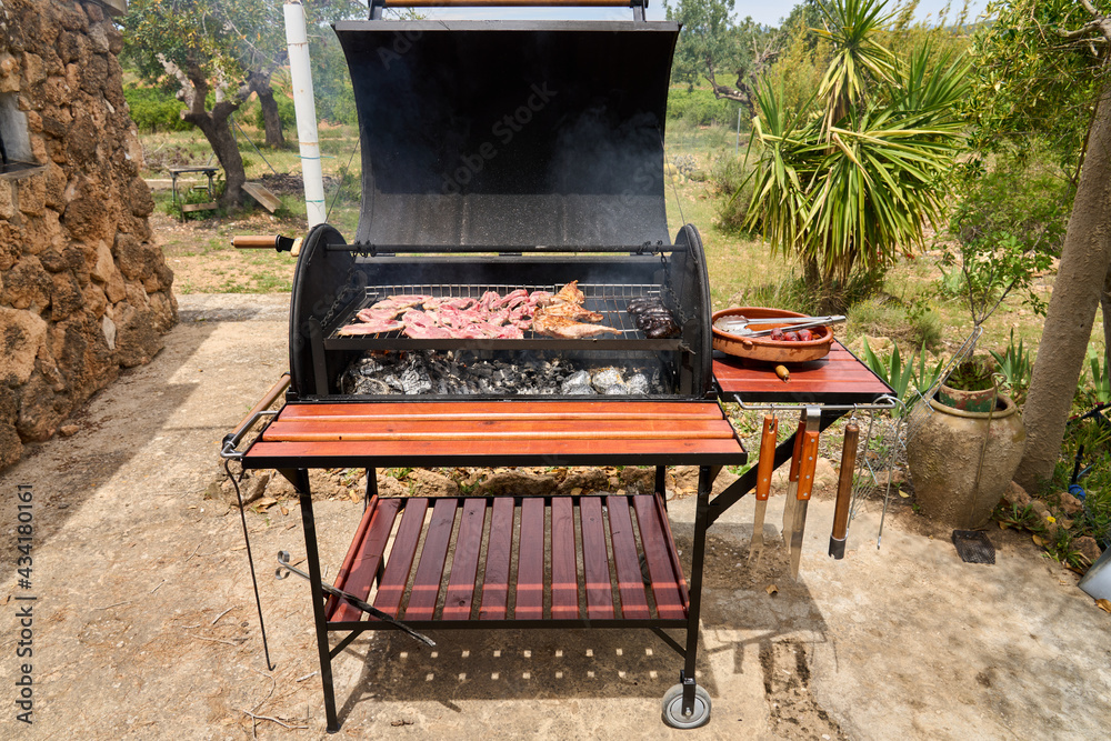 cooking on a charcoal and wood barbecue cooking on a charcoal and wood barbecue