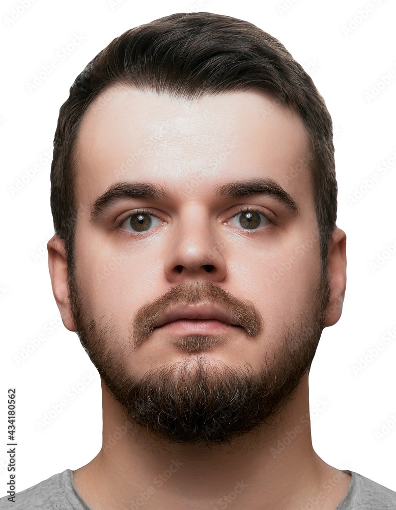 Fototapeta premium Headshot of bearded man with neutral facial expression. Isolated portrait photo for documents and visa