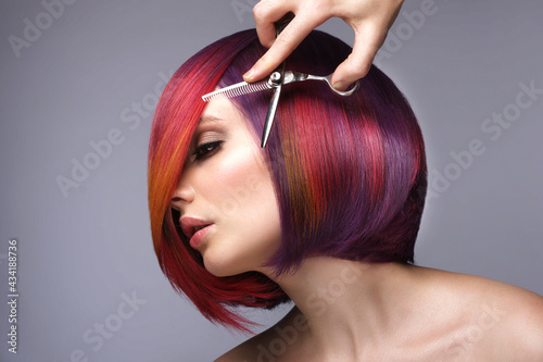 Valokuvatapetti Beautiful woman with multi-colored hair and creative make up and hairstyle