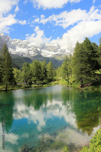 Fototapeta Naklejka Na Ścianę i Meble -  Summer alpine landscape with the Matterhorn (Cervino) reflected on the Blue Lake (Lago Blu) near Breuil-Cervinia, Aosta Valley, northern Italy