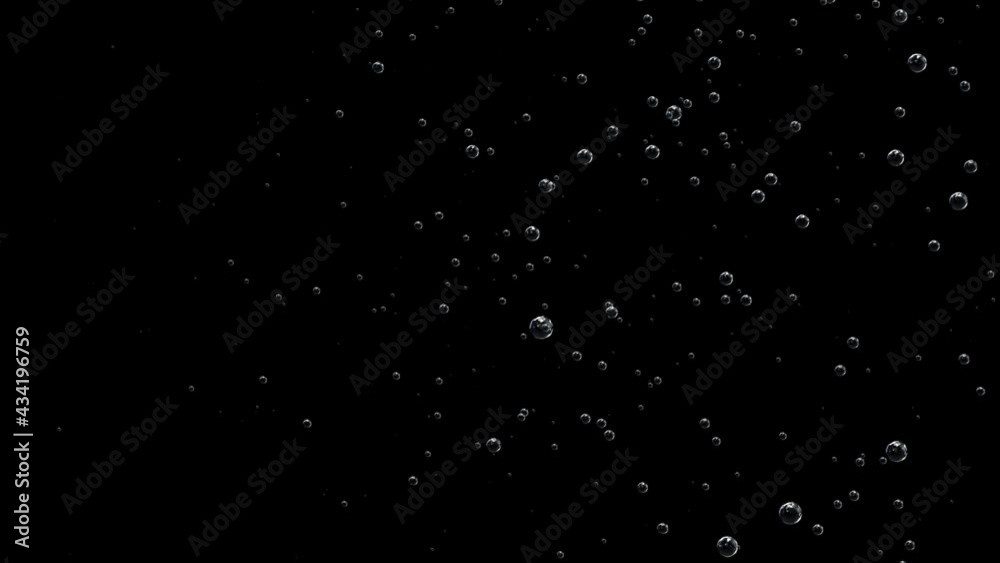 Bubbles on a black background fly and swirl like snowflakes in a storm. Bubbles on a black background fly and swirl like snowflakes in a storm.