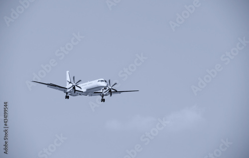 Biplane plane with propellers landing